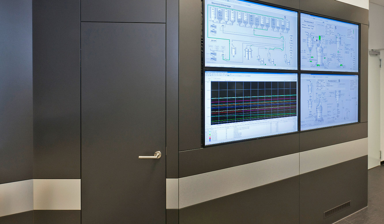 JST-SGL Carbon Group: control centre. Door to the inspection room in the large display wall cladding
