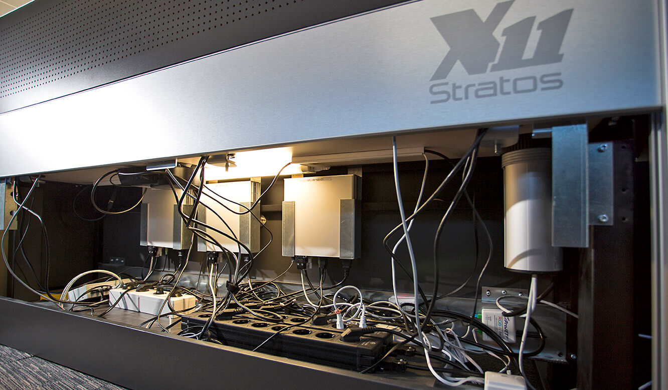 JST - Raiffeisen Graz: Control centre desk. Inspection hatch open.