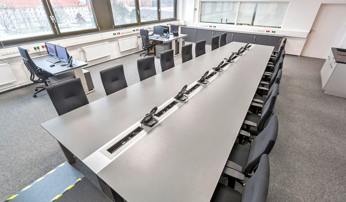 JST - Autorisierte Stelle Digitalfunk Niedersachsen: Storage room with AllMedia conference table