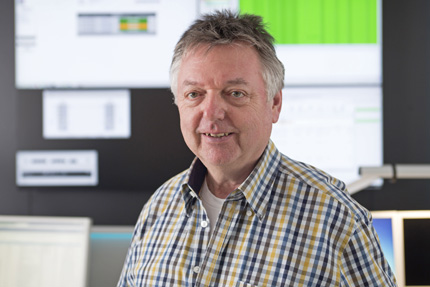 JST Dataport Control Centre Manager Klaus Greiser in front of the large display wall