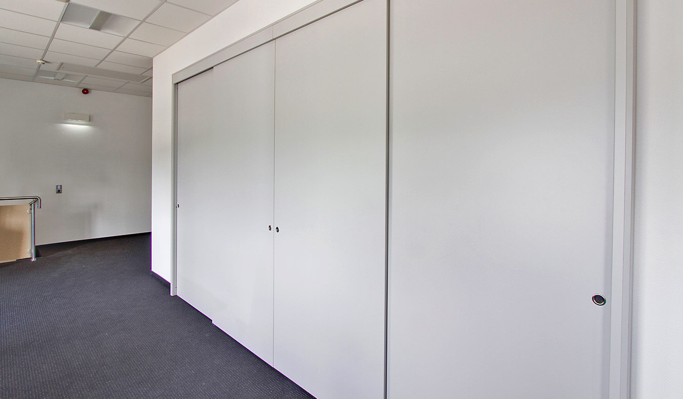 JST References - NWKG Wilhelmshaven - control centre. Sliding doors as large display wall cladding