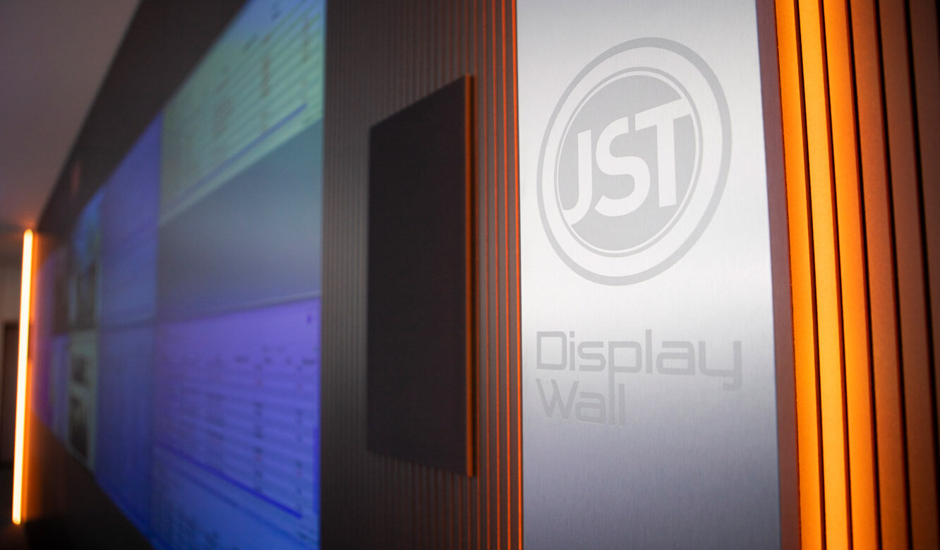 JST - ovag Netz GmbH - Network control center: Stainless steel design strips and optical alarm on the monitor wall