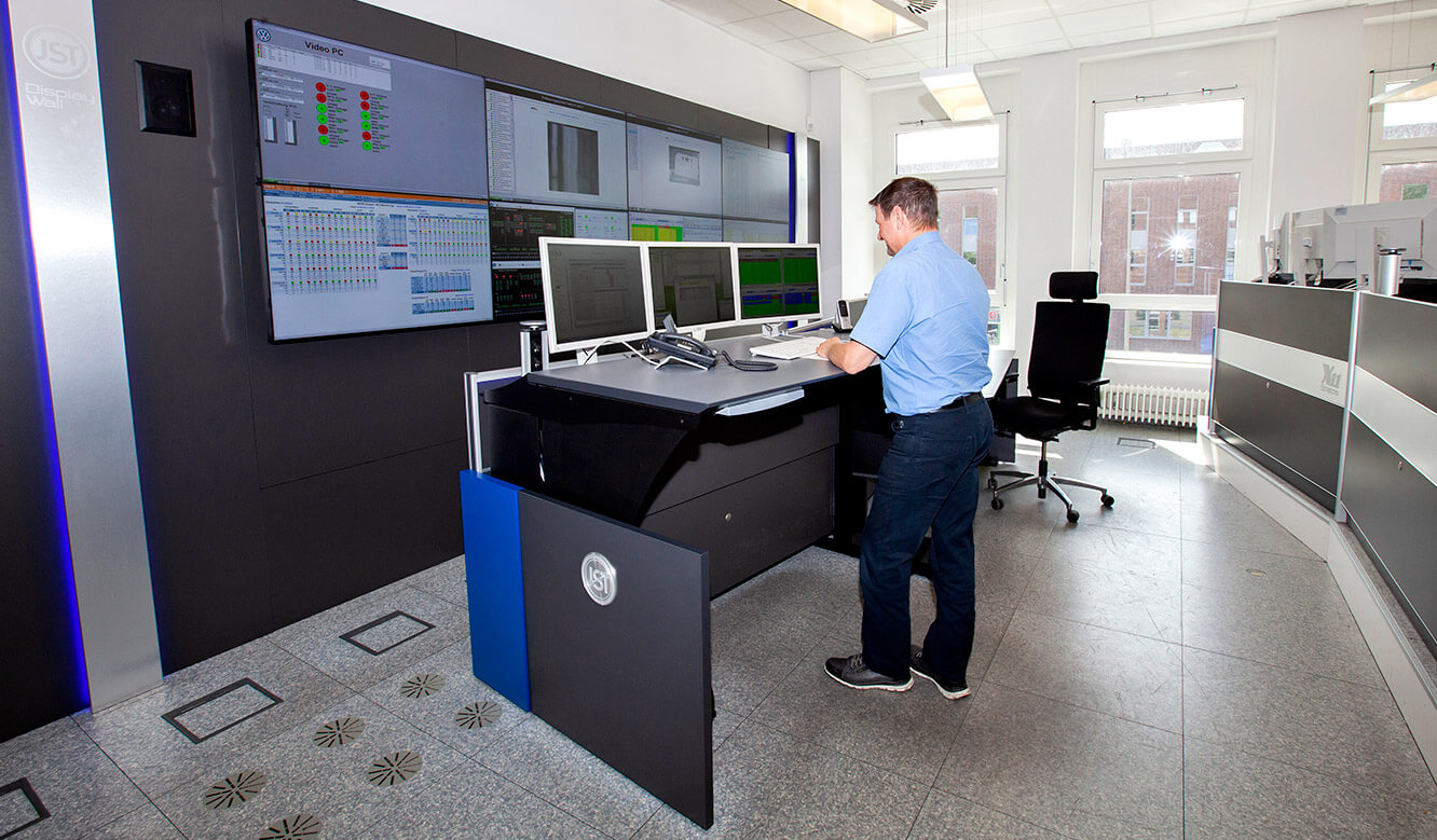 JST Volkswagen FIS control room: ergonomically height-adjustable operator desk in standing position