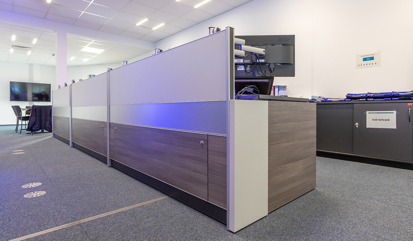 JST reference Bremen Police Video control centre: Table for control centre with technology storage room and ergonomic concept