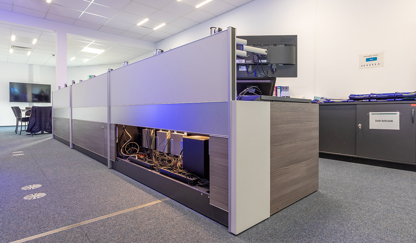 JST reference Bremen Police Video control centre: Table for control room with space for technology and ergonomic solution