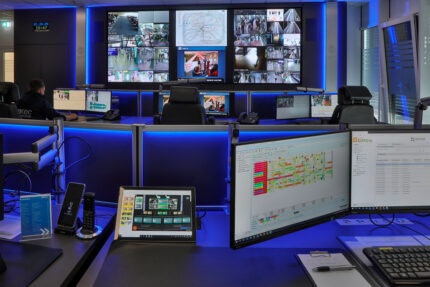 JST reference protec service GmbH - modern IT solution mission control center - ergonomic furniture and modern large screen technology